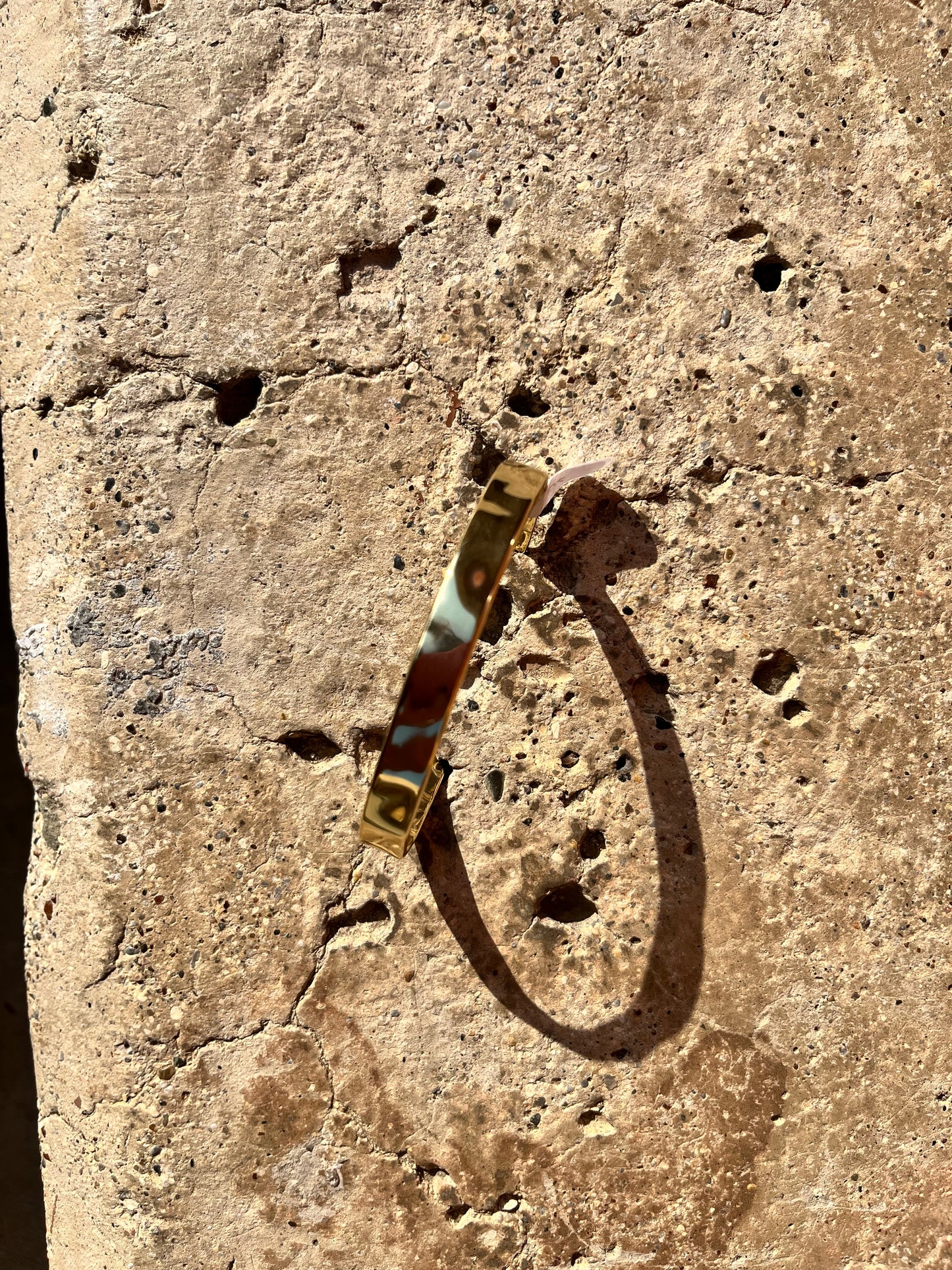 Gold pleated textured hand cuff