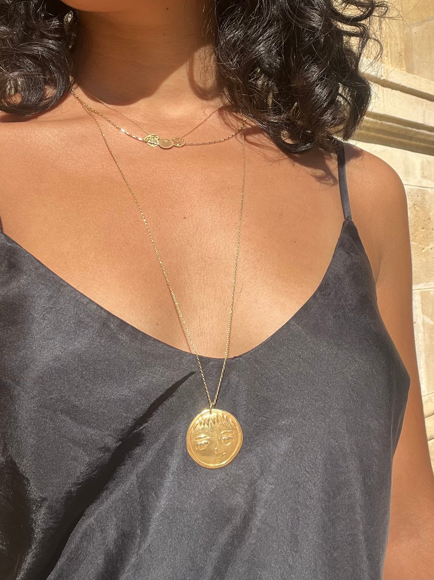 Face gold necklace