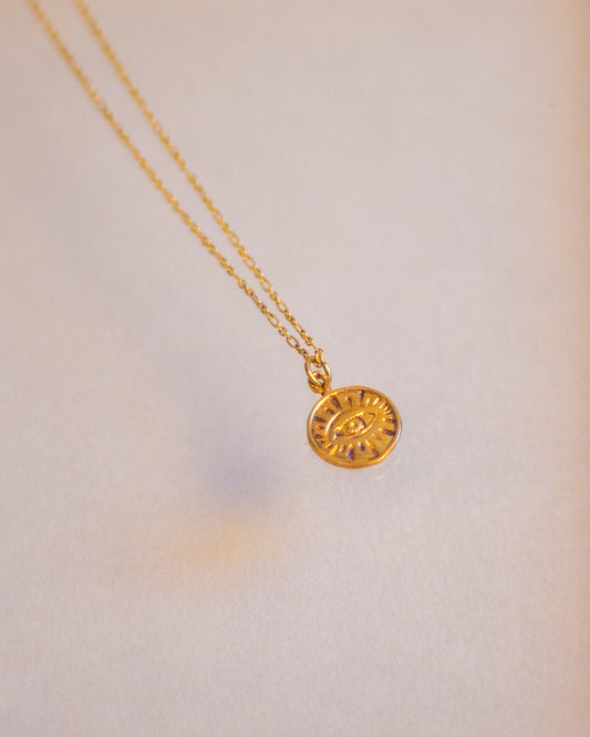 Gold eye necklace