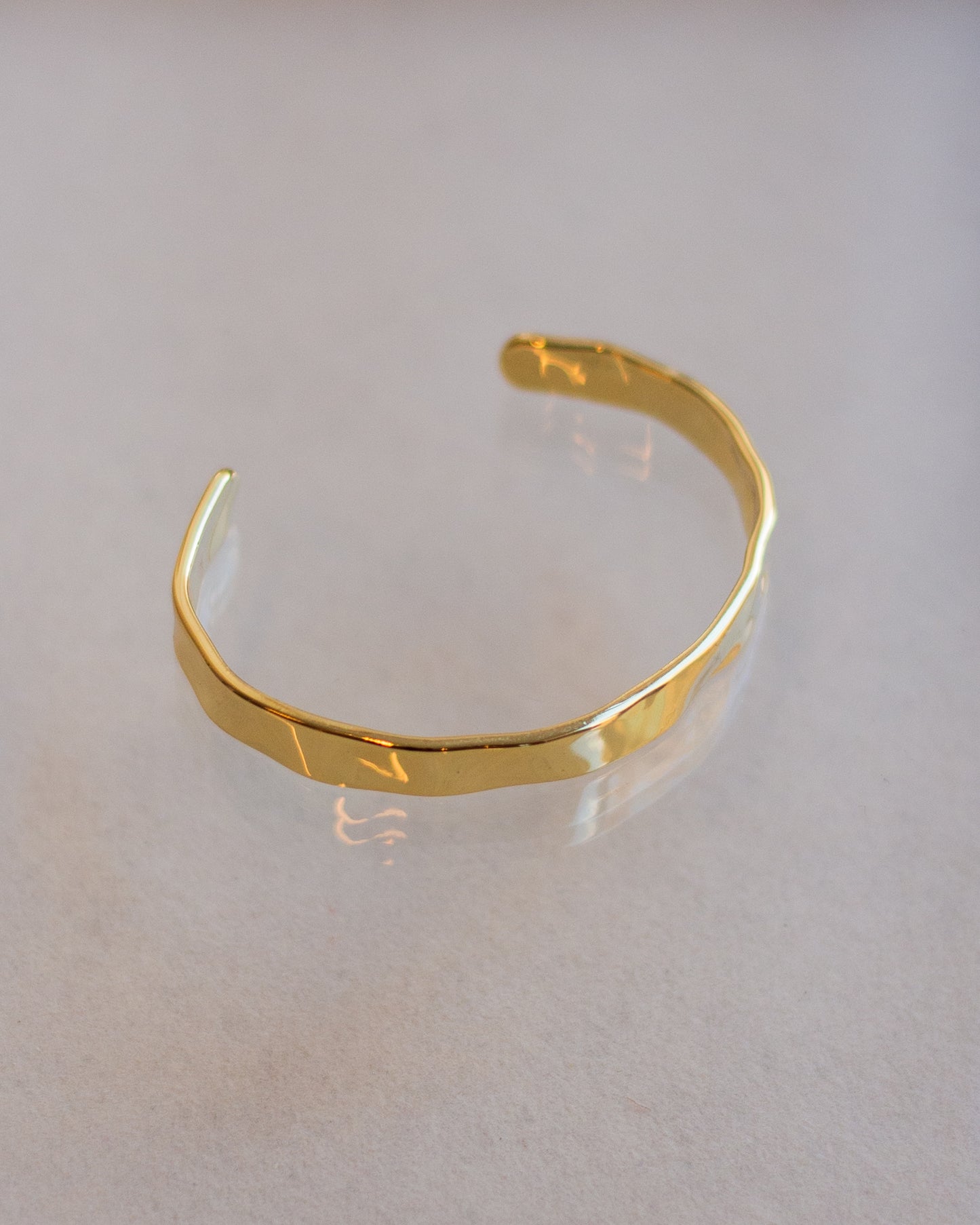 Gold pleated textured hand cuff