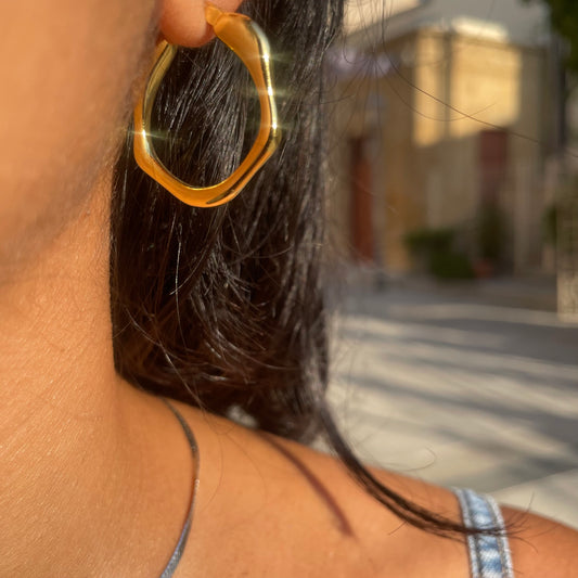 Gold asymmetric hoop earrings
