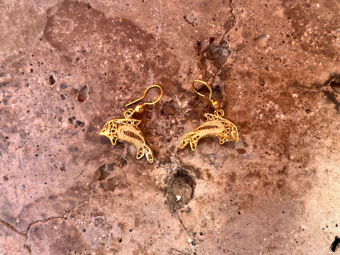 Gold dolphin earrings