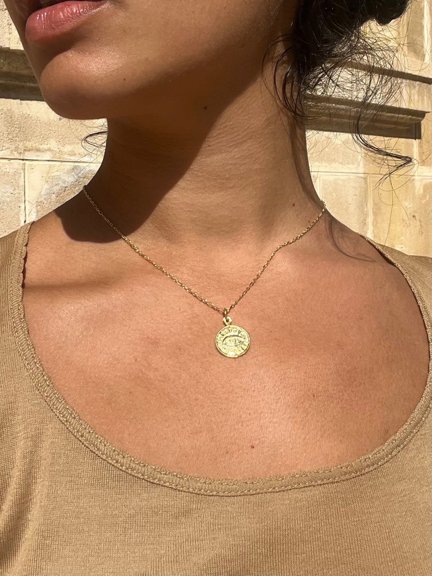 Gold eye necklace