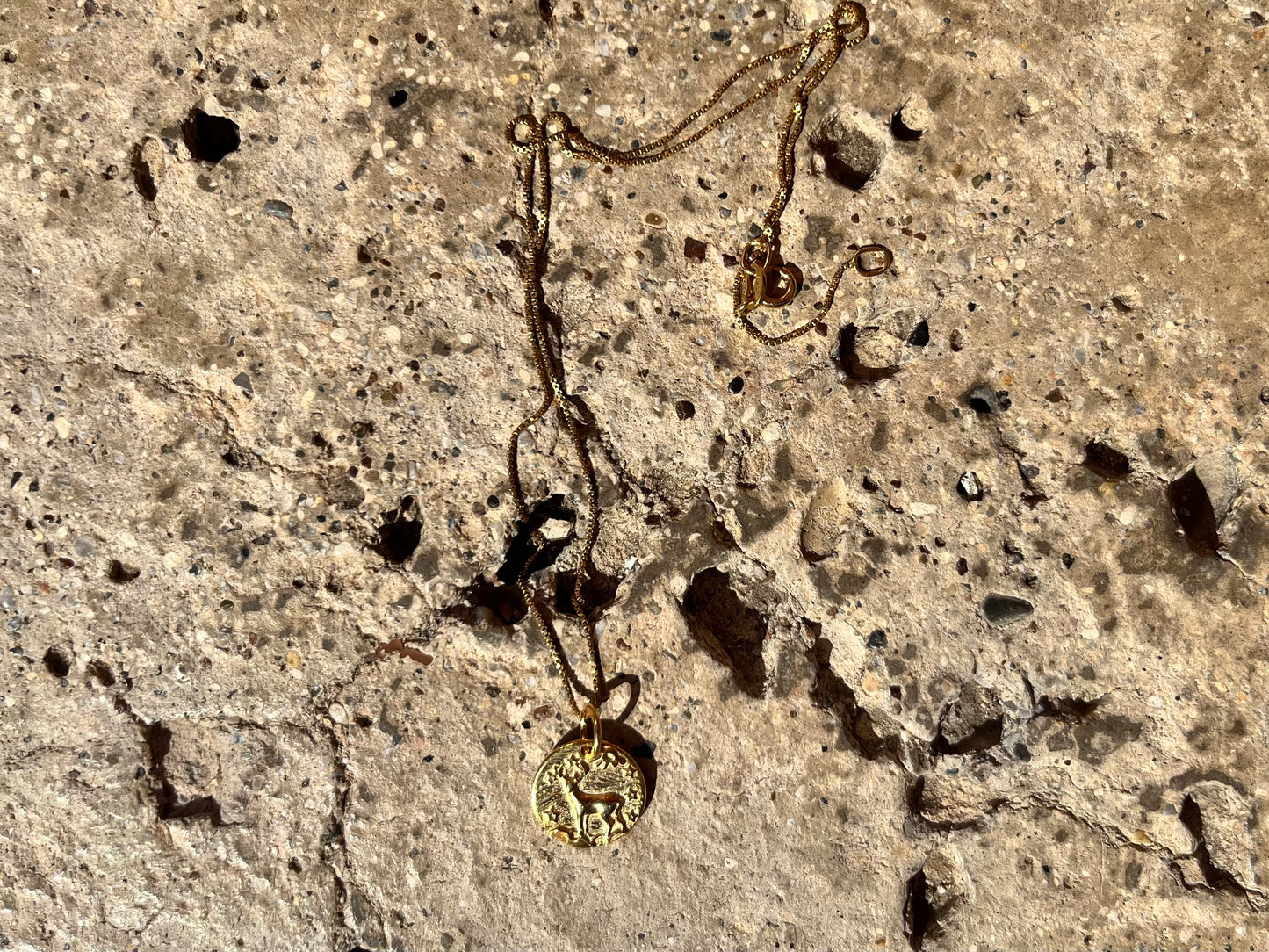 Gold mouflon necklace