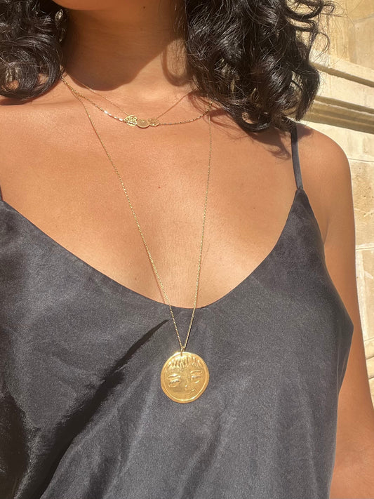 Face gold necklace